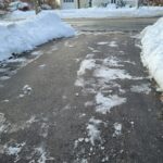A,Driveway,That,Has,Been,Cleared,Of,Snow.,The,Blacktop