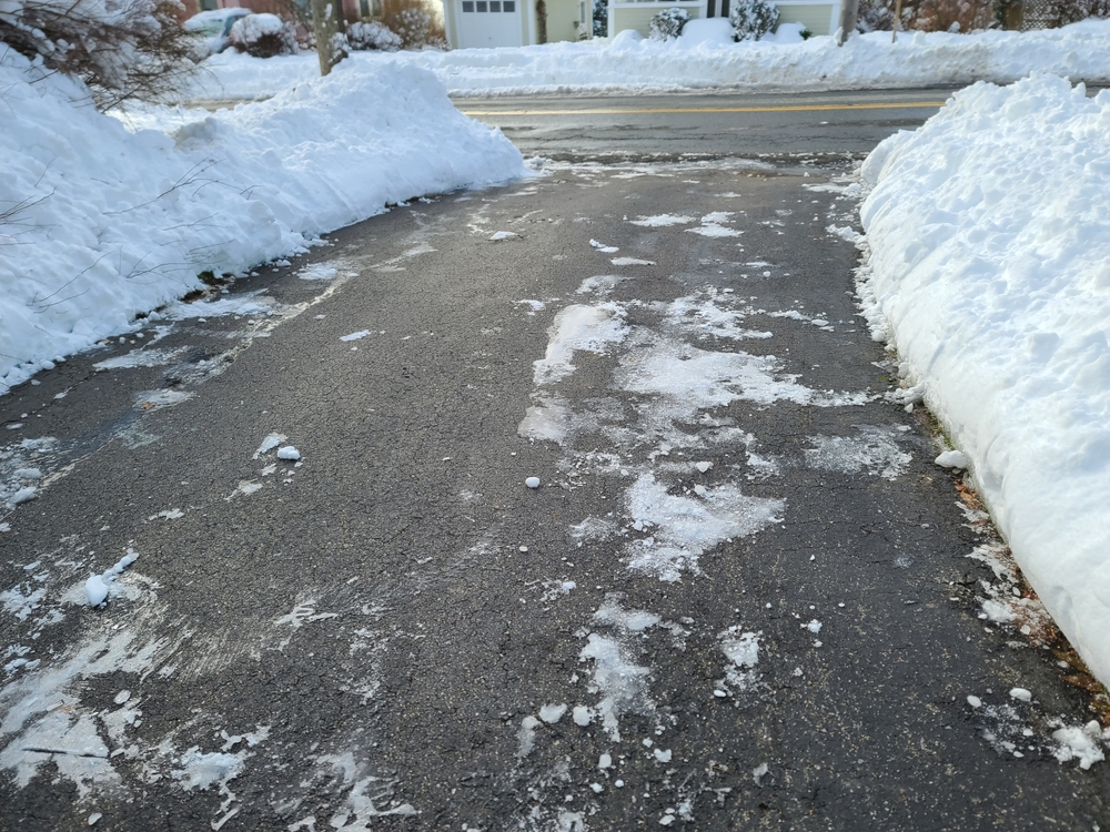 A,Driveway,That,Has,Been,Cleared,Of,Snow.,The,Blacktop