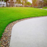 Green,Grass,Lawn,And,Gray,Curve,Pattern,Walkway,,Sand,Washed